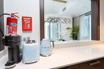 a kitchen with a counter with a coffee maker on it at PVH - Elegant 2BR near Dubai Mall - Opera Grand in Dubai