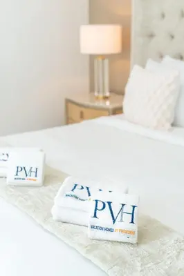 a couple of towels sitting on a bed at PVH - Elegant 2BR near Dubai Mall - Opera Grand in Dubai
