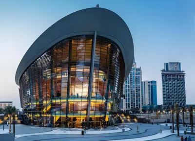 a large glass building in a city with buildings at Luxury Grande Signature Apartment in Dubai Downtown Steps to Dubai Mall and Burj Khalifa with Stunning Pool View by La Brisa Dubai in Dubai