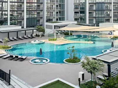 an overhead view of a large swimming pool in a building at Inspiring 1BR Apartment at Sobha Hartland in Dubai