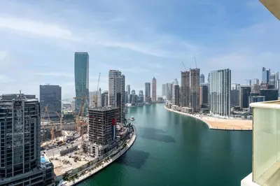 a view of a river in a city with buildings at GuestReady - Damac Prive | 1BR Canal View in Dubai