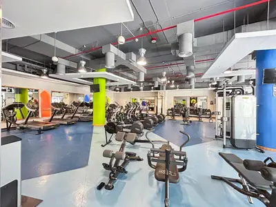 a gym with lots of treadmills and exercise bikes at Central JBR Home Steps away from the Beach in Dubai