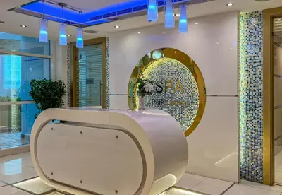 a dressing room with a mirror on the wall at Park Central, Business Bay - Studio Apartment - Allsopp & Allsopp in Dubai