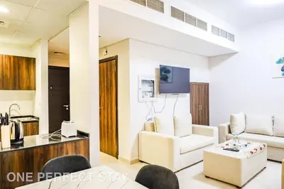 a living room with a couch and a chair at Elegant 3BR Villa - Peaceful - Family Friendly in Dubai
