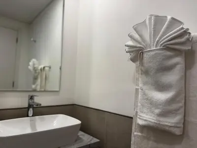 a bathroom with a sink and a bath tub at Luxury 1BR in Madinat Jumeirah Living in Dubai