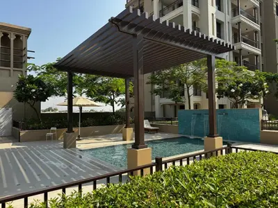 a gazebo with a pool in front of a building at Luxury 1BR in Madinat Jumeirah Living in Dubai