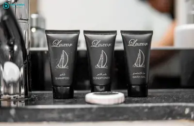 a group of four products sitting on a counter at Blue Breeze Modern 2BR Apartment Near Downtown in Dubai