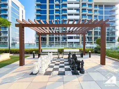 a chess board with a chess boardgame on a chess board at Premium Riviera Studio King Bed, Pool & Gym in Dubai