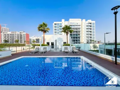 a swimming pool on the roof of a building at Premium Riviera Studio King Bed, Pool & Gym in Dubai