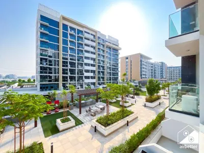 an aerial view of a building with a courtyard at Premium Riviera Studio King Bed, Pool & Gym in Dubai