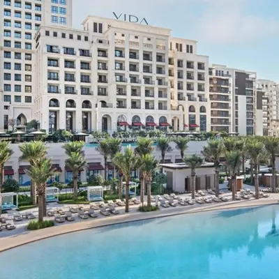 a view of a hotel with a large swimming pool at Vida Residences - Luxury & Serenity - Creek Beach in Dubai