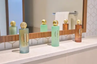 a bathroom counter with five vases on it at Vida Residences - Luxury & Serenity - Creek Beach in Dubai