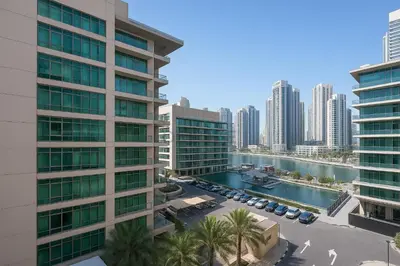 an aerial view of a city with tall buildings at Prime 2BR with Mesmerizing Canal Views, Stone Throw from Marina Mall and Metro, Minutes Walk to JBR Beach, Al Majara 1, Dubai Marina by Deluxe Holiday Homes in Dubai