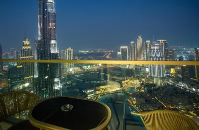 a view of a city at night from the top of a building at Skyline Splendor 2bedroom with Burj Khalifa View in Dubai