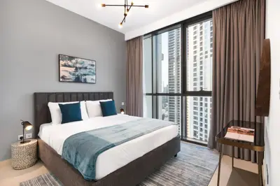 a bedroom with a large bed and a large window at Downtown views 1 Bedroom 5 PAX direct Dubai mall in Dubai