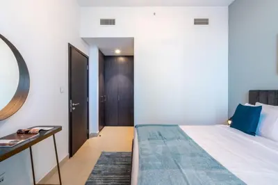 a bedroom with a bed and a mirror at Downtown views 1 Bedroom 5 PAX direct Dubai mall in Dubai