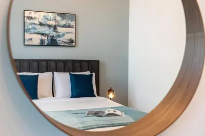 a bedroom with a bed and a mirror at Downtown views 1 Bedroom 5 PAX direct Dubai mall in Dubai