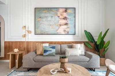 a living room with a couch and a table at GuestReady - 2BR l High-Rise Elegance in Dubai