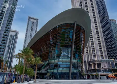 a building in a city with tall buildings at Stunning One bed Dubai mall downtown in Dubai