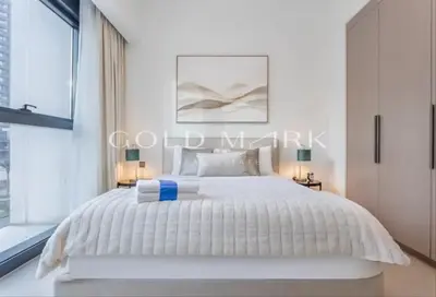 a bedroom with a white bed and a window at Stunning One bed Dubai mall downtown in Dubai