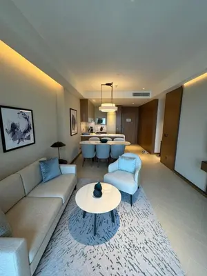 a living room with a couch and a table at 2 Bedroom Apartment in Address Opera Residences in Dubai