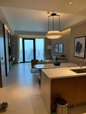 a kitchen and living room with a view of a living room at 2 Bedroom Apartment in Address Opera Residences in Dubai