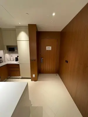 an empty room with a kitchen and a door at 2 Bedroom Apartment in Address Opera Residences in Dubai