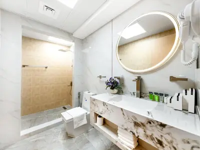 a bathroom with a sink and a mirror at New Renovate Huge Flat w Canal & Burj Khalifa view in Dubai