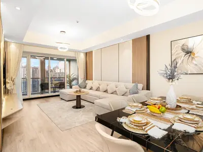 a living room with a table and a couch at New Renovate Huge Flat w Canal & Burj Khalifa view in Dubai