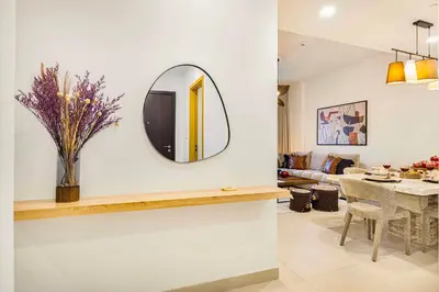 a living room with a mirror on the wall at Premium 3BR apartment with Burj Khalifa view, Downtown Dubai in Dubai