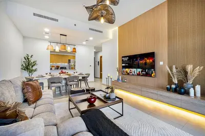 a living room with a couch and a table at Premium 3BR apartment with Burj Khalifa view, Downtown Dubai in Dubai