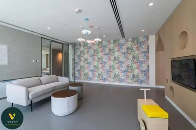 a living room with a couch and a table at Vogue Downtown Views II with Direct Access to Dubai Mall Via a Climate Controlled Bridge, One Bedroom Apartment with Balcony and City View in Dubai