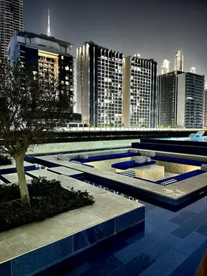 a view of a city skyline with tall buildings at Luxury 2BR with Dubai Canal View Near Burj Khalifa in Dubai