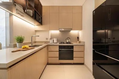a kitchen with a sink and a stove top oven at Vida Dubai Mall! 2 Bedroom with Burj Khalifa View! Direct Access to Dubai Mall in Dubai