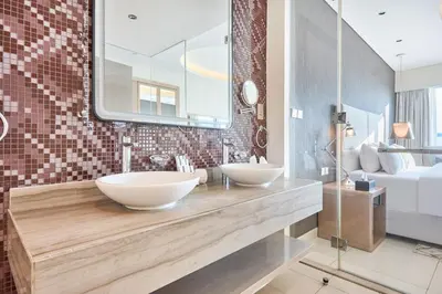 two sinks in a bathroom with a large mirror at Burj Khalifa View High-Floor Upgraded 3Bed Apt in Dubai
