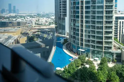 a view of a pool from a building at Boulevard Point I Burj Khalifa Fireworks View in Dubai
