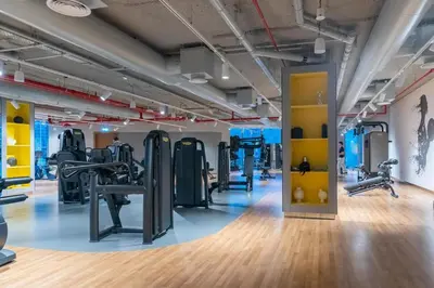 a gym with treadmills and cardio machines at King 2 Bedroom With Burj Khalifa View & Dubai Mall Access in Dubai
