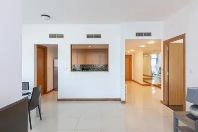 a hallway with a white wall in a building at Two Bedroom apartment - Dubai Marina in Dubai