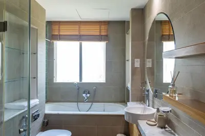 a bathroom with a tub and a toilet and a sink at Two Bedroom apartment - Dubai Marina in Dubai