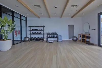 a large room with a fitness room with a gym at Casa Haven Retreat in Dubai