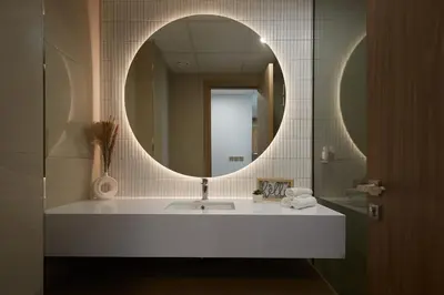 a bathroom with a white sink and a mirror at Casa Haven Retreat in Dubai