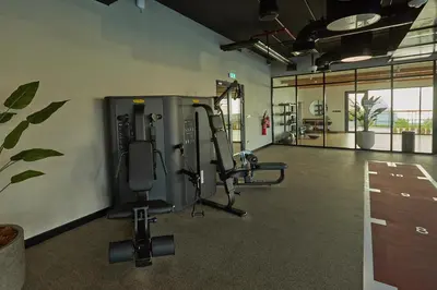 a gym with two treadmills and tread machines at Casa Haven Retreat in Dubai