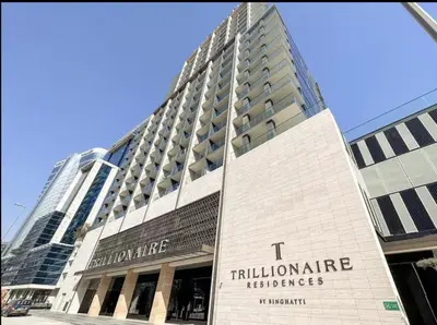 a tall building with a sign on the front of it at Studio Apartments with Private Jacuzzi - Spa - Cold Plunge - Gym in Business Bay in Dubai