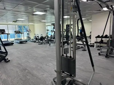 a gym with several treadmills and exercise machines at Prestigious 2BR with nice View of Marina Dubai in Dubai
