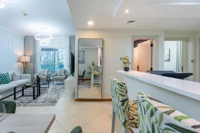 a living room with a couch and a table at Prestigious 2BR with nice View of Marina Dubai in Dubai