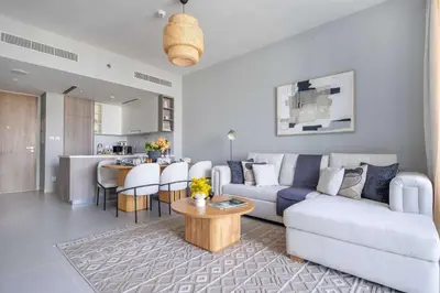 a living room with a couch and a table at Frank Porter - Liv Marina in Dubai