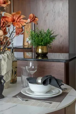 a table with a plate and a bowl on a table at Frank Porter - Boulevard Walk Downtown in Dubai