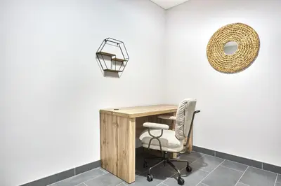 an office with a desk and a chair at STAY BY LATINEM Luxury 1BR Plus Study Holiday Home CC 3109 Near Burj Khalifa in Dubai