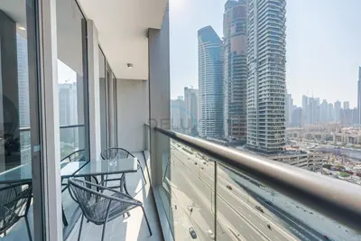 a balcony with a view of a city at Burj Khalifa Views, Walking Distance to Dubai Mall and Downtown Boulevard - The Sterling West House, Business Bay by Deluxe Holiday Homes in Dubai