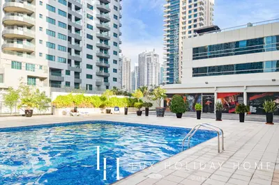 a swimming pool in a city with tall buildings at LUX The Marina View Suite 3 in Dubai